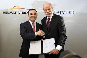 Carlos Ghosn (left) and Daimler Chairman Dieter  Zetsche celebrate the launch of their partnership.